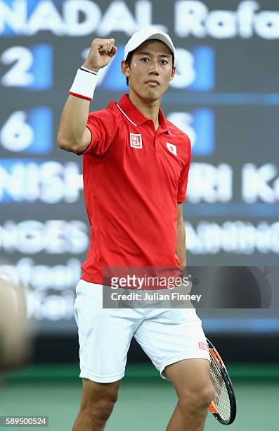 Kei Nishikori of Japan celebrates match point to win the singles bronze medal match against Rafael Nadal of Spain on Day 9 of the Rio 2016 Olympic...
