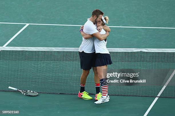 Jack Sock and Bethanie Mattek-Sands of the United States celebrate victory in the mixed doubles gold medal match against Rajeev Ram and Venus...