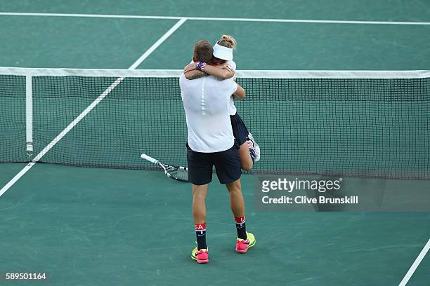 Jack Sock and Bethanie Mattek-Sands of the United States celebrate victory in the mixed doubles gold medal match against Rajeev Ram and Venus...