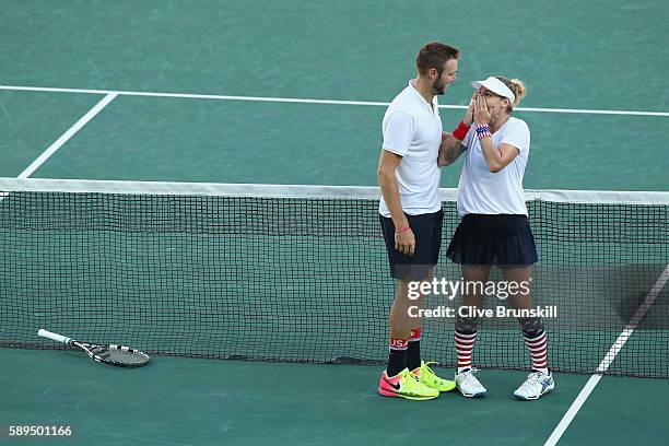 Jack Sock and Bethanie Mattek-Sands of the United States celebrate victory in the mixed doubles gold medal match against Rajeev Ram and Venus...