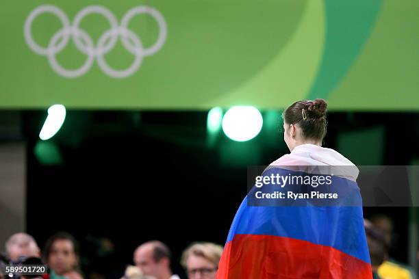 Aliya Mustafina of Russia celebrate winning the gold medal after the Women's Uneven Bars Final on Day 9 of the Rio 2016 Olympic Games at the Rio...