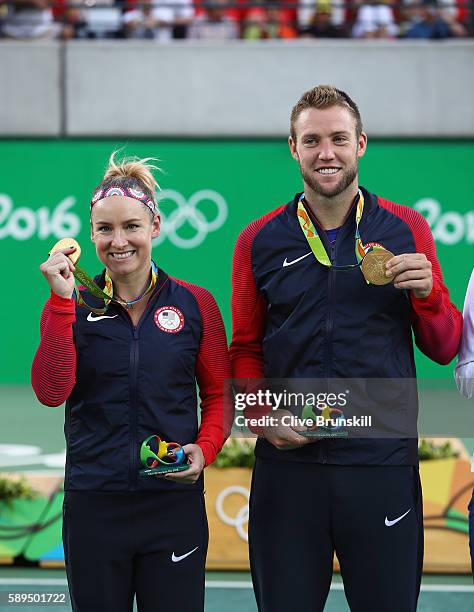 Gold medalists Jack Sock and Bethanie Mattek-Sands of the United States pose on the podium during the ceremony for the mixed doubles on Day 9 of the...