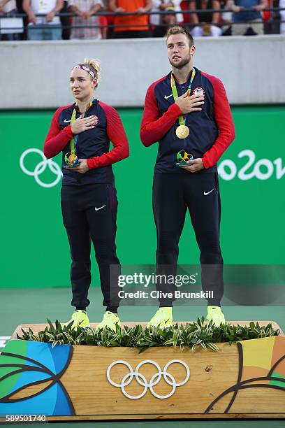 Gold medalists Jack Sock and Bethanie Mattek-Sands of the United States pose on the podium during the ceremony for the mixed doubles on Day 9 of the...
