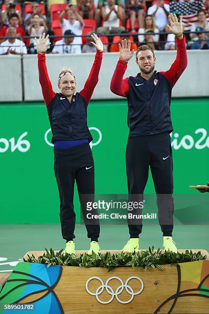 Gold medalists Jack Sock and Bethanie Mattek-Sands of the United States pose on the podium during the ceremony for the mixed doubles on Day 9 of the...