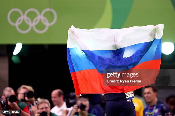 Aliya Mustafina of Russia celebrate winning the gold medal after the Women's Uneven Bars Final on Day 9 of the Rio 2016 Olympic Games at the Rio...