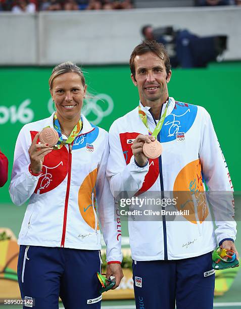 Bronze medalists Lucie Hradecka and Radek Stepanek of the Czech Republic pose on the podium during the ceremony for the mixed doubles on Day 9 of the...