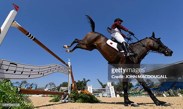 Qatar's Ali Yousef Al Rumaihi on Gunder competes during the Equestrian's Show Jumping first qualifier event of the 2016 Rio Olympic Games at the...