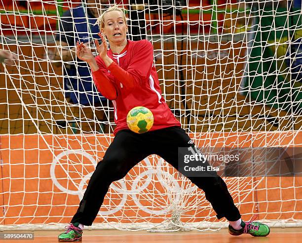 Katrine Lunde of Norway stops a shot in the first half against Romania on Day 9 of the Rio 2016 Olympic Games at the Future Arena on August 14, 2016...