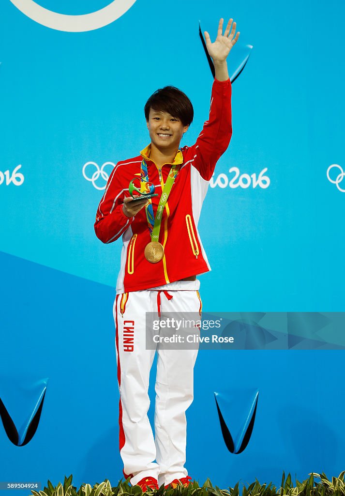 Gold medalist Tingmao Shi of China celebrates on the podium during Gold medalist Tingmao Shi of China celebrates on the podium during