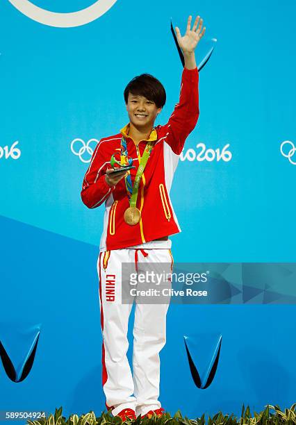 Gold medalist Tingmao Shi of China celebrates on the podium during the medal ceremony for the Women's Diving 3m Springboard Final on Day 9 of the Rio...