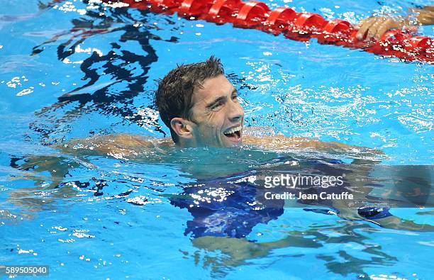 Michael Phelps of USA celebrates winning the silver medal following the Men's 100m Butterfly final on day 7 of the Rio 2016 Olympic Games at Olympic...