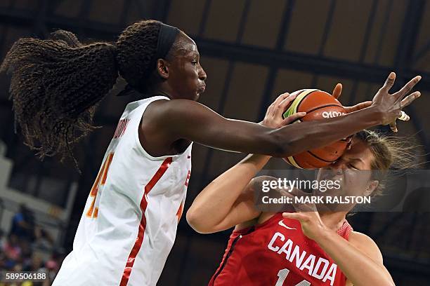 Spain's power forward Astou Ndour defends against Canada's power forward Katherine Plouffe during a Women's round Group B basketball match between...