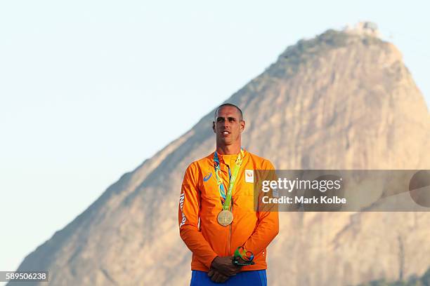 Dorian van Rijsselberghe of the Netherlands celebrates winning the gold medal in the Men's RS:X class on Day 9 of the Rio 2016 Olympic Games at the...