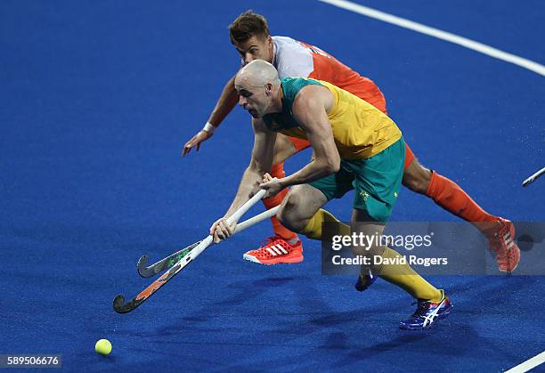 Glenn Turner of Australia moves away from Sander de Wijn during the Men's hockey quarter final match between the Netherlands and Australia on Day 9...