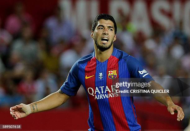 Barcelona's Uruguayan forward Luis Suarez reacts during the first leg of the Spanish Supercup football match between Sevilla FC and FC Barcelona at...