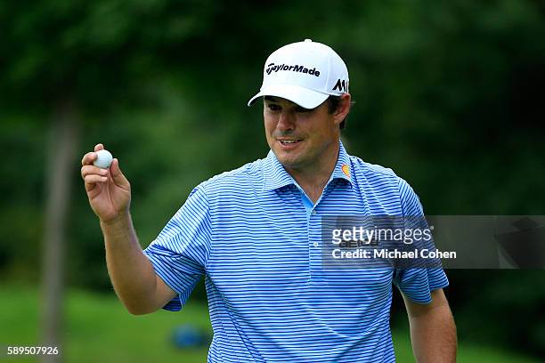 Johnson Wagner acknowledges the crowd after his birdie on the 14th hole during the final round of the John Deere Classic at TPC Deere Run on August...