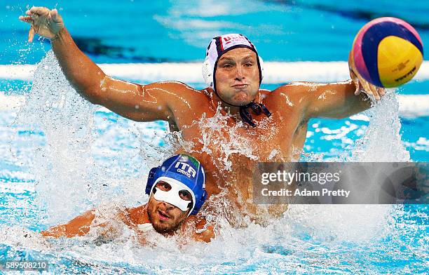 Jesse Smith of the USA marks Matteo Aicardi of Italy during the USA vs Italy Waterpolo group match at Julio de Lamare Aquatics Centre on August 14,...
