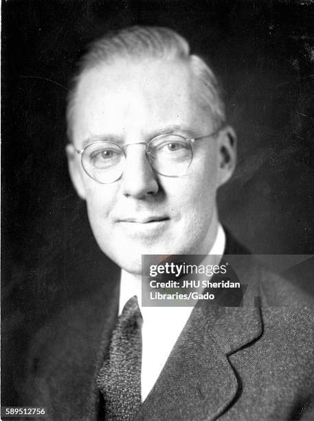 Portrait, shoulders up, of Howard Earl Cooper, professor of business and president of McCoy College, later renamed to Carey Business School, Johns...