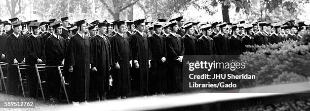 The Johns Hopkins University class of 1947 stands in rows in academic dress during their commencement ceremony on the University's Homewood campus in...