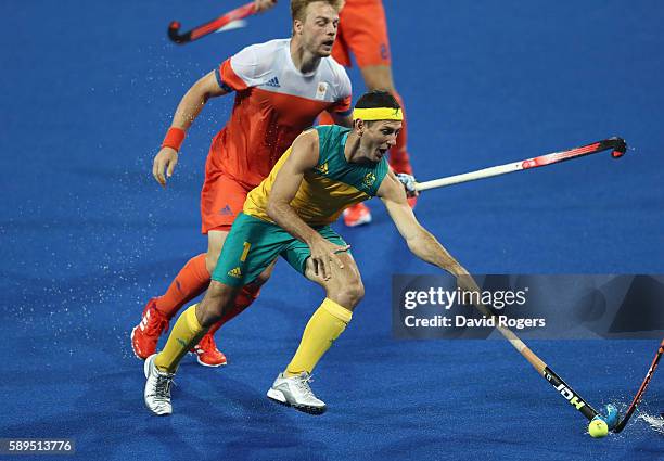 Jamie Dwyer of Australia stretches for the ball during the Men's hockey quarter final match between the Netherlands and Australia on Day 9 of the Rio...
