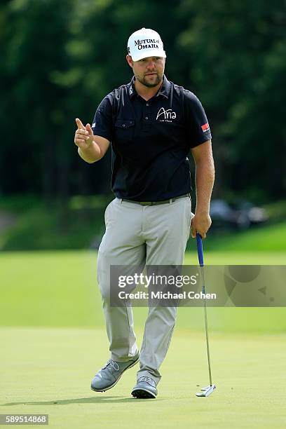 Ryan Moore reacts to his shot on the eighth hole during the final round of the John Deere Classic at TPC Deere Run on August 14, 2016 in Silvis,...