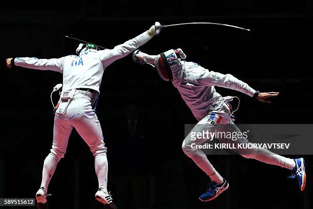 Italy's Paolo Pizzo competes against France's Yannick Borel during the mens team epee gold medal bout between Italy and France as part of the fencing...