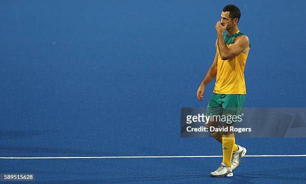 Jamie Dwyer of Australia looks dejected as he leaves the pitch after Australia's 4-0 defeat during the Men's hockey quarter final match between the...