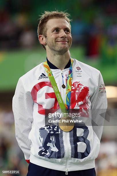 Gold medalist Jason Kenny of Great Britain poses for photographs after the medal ceremony for Men's Sprint on Day 9 of the Rio 2016 Olympic Games at...