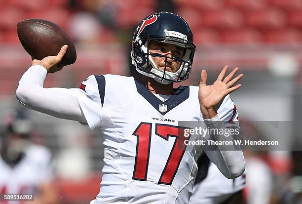 Quarterback Brock Osweiler of the Houston Texans throws during pregame warm ups prior to playing the San Francisco 49ers in a preseason game at...