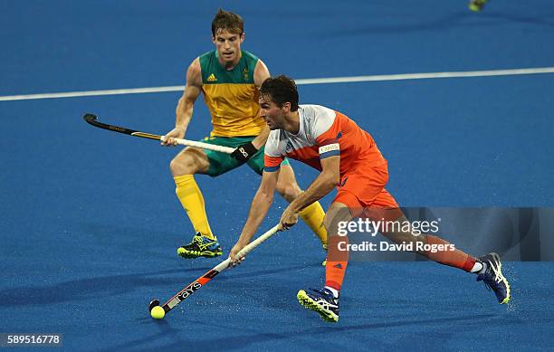 Robert van der Horst of the Netherlands moves away with the ball during the Men's hockey quarter final match between the Netherlands and Australia on...