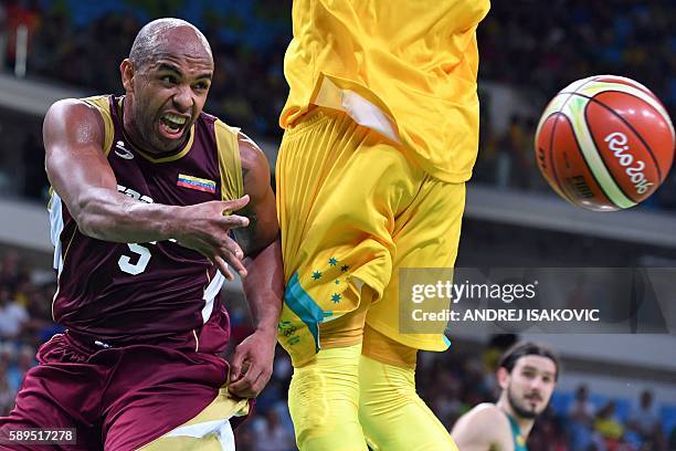 Venezuela's point guard Gregory Vargas passes the ball during a Men's round Group A basketball match between Australia and Venezuela at the Carioca...