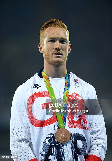 Greg Rutherford of Great Britain poses with the poses with the bronze medal for Men's Long Jump on Day 9 of the Rio 2016 Olympic Games at the Olympic...