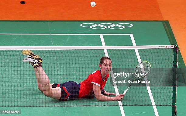 Kirsty Gilmore of Great Britain dives for a shot during her Women's Singles Group match against Linda Zetchiri of Bulgaria during the Table Tennis...