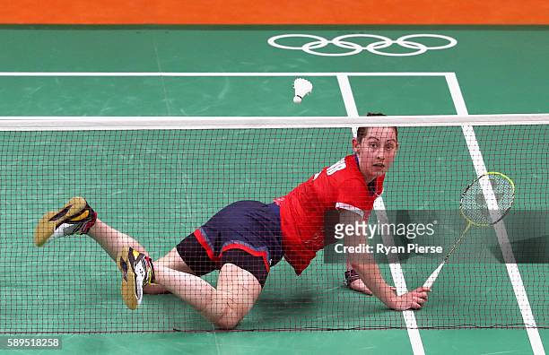 Kirsty Gilmore of Great Britain dives for a shot during her Women's Singles Group match against Linda Zetchiri of Bulgaria during the Table Tennis...