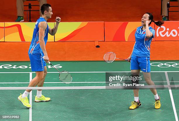 Yunlei Zhao and Nan Zhang of China celebrate during their Mixed Doubles Quarter Final match against Japan during on Day 9 of the Rio 2016 Olympic...