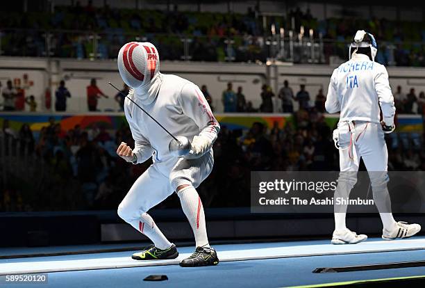 Kazuyasu Minobe of Japan celebrates winning against Marco Fichera of Italy in the Men's Epee Individual Table of 32 match on Day 4 of the Rio 2016...