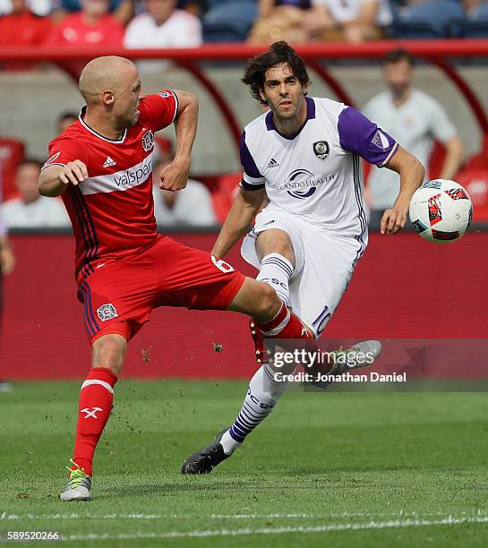 Kaka of Orlando City FC fires a shot past Eric Gehrig of Chicago Fire during an MLS match at Toyota Park on August 14, 2016 in Bridgeview, Illinois....