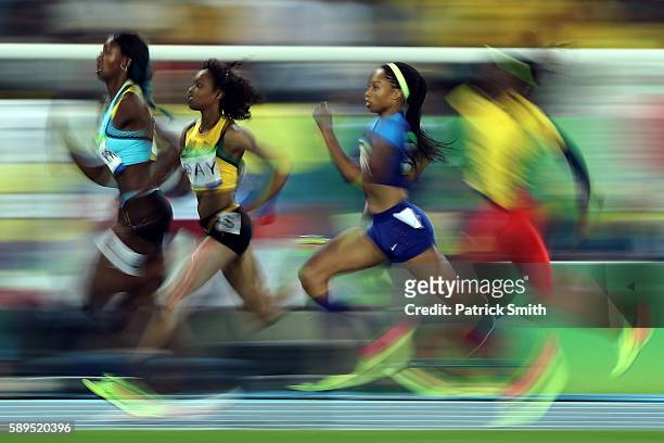 Allyson Felix of the United States, Christine Day of Jamaica and Shaunae Miller of the Bahamas compete in the Women's 400 meter semifinal on Day 9 of...