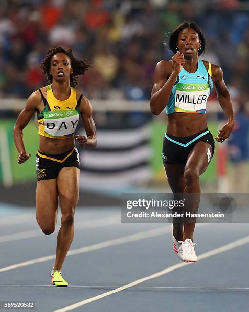 Christine Day of Jamaica and Shaunae Miller of the Bahamas compete in the Women's 400 meter semifinal on Day 9 of the Rio 2016 Olympic Games at the...