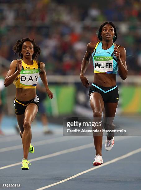 Christine Day of Jamaica and Shaunae Miller of the Bahamas compete in the Women's 400 meter semifinal on Day 9 of the Rio 2016 Olympic Games at the...