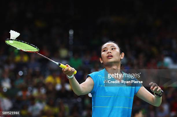 Tzu Ying Tai of Chinese Taipei plays a shot during her Badminton Women's Singles Group match against Natalia Perminova of Russia on Day 9 of the Rio...