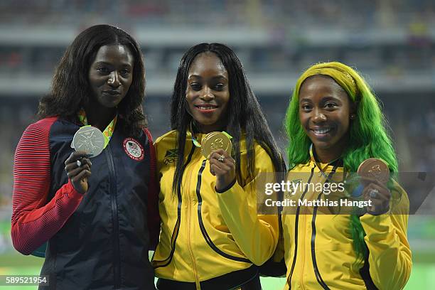 Elaine Thompson of Jamaica poses with the gold medal Tori Bowie of the United States, silver medal, and Shelly-Ann Fraser-Pryce of Jamaica, bronze...