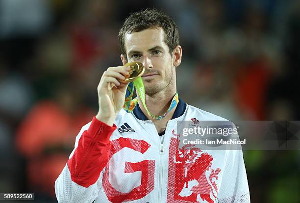 Andy Murray of Great Britain poses with his Gold medal after defeating Juan Martin del Potro of Argentina in the Men's singles final at Olympic...