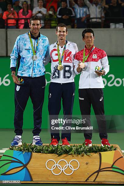 Silver medalist Juan Martin Del Potro of Argentina, gold medalist Andy Murray of Great Britain and bronze medalist Kei Nishikori of Japan pose during...