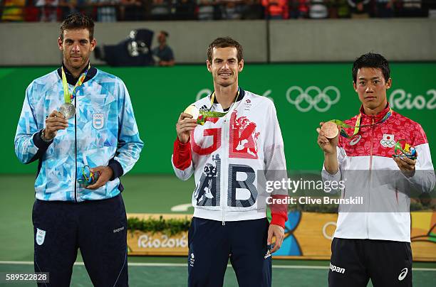 Silver medalist Juan Martin Del Potro of Argentina, gold medalist Andy Murray of Great Britain and bronze medalist Kei Nishikori of Japan pose during...