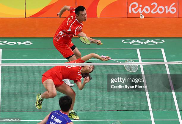 Jin Ma and Chen Xu of China in action during their Mixed Doubles Quarter Final match against Korea during on Day 9 of the Rio 2016 Olympic Games at...