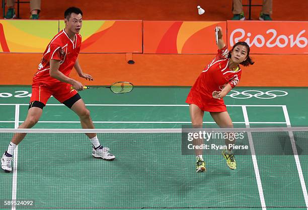 Jin Ma and Chen Xu of China play a shot during their Mixed Doubles Quarter Final match against Korea during on Day 9 of the Rio 2016 Olympic Games at...