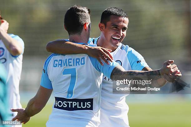 New signing Tim Cahill hugs Corey Gameiro of the City during a Melbourne City A-League press conference at La Trobe University Sports Fields on...