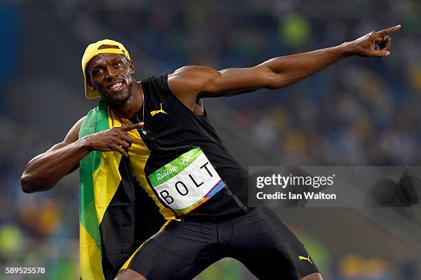 Usain Bolt of Jamaica celebrates winning the Men's 100m Final on Day 9 of the Rio 2016 Olympic Games at the Olympic Stadium on August 14, 2016 in Rio...