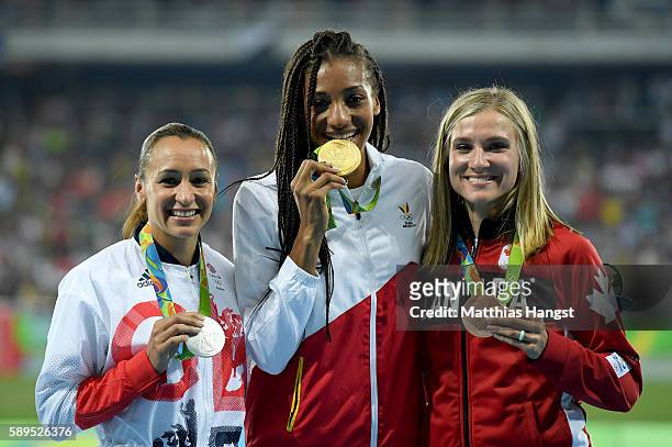 Nafissatou Thiam of Belgium poses with the gold medal, Jessica Ennis-Hill of Great Britain, silver medal, and Brianne Theisen Eaton of Canada, bronze...